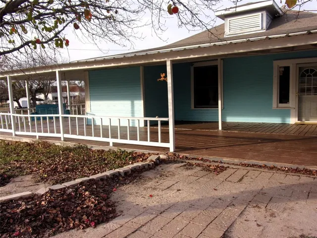 a view of porch with wooden floor