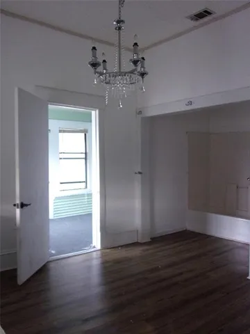 a bathroom with a sink window and a mirror