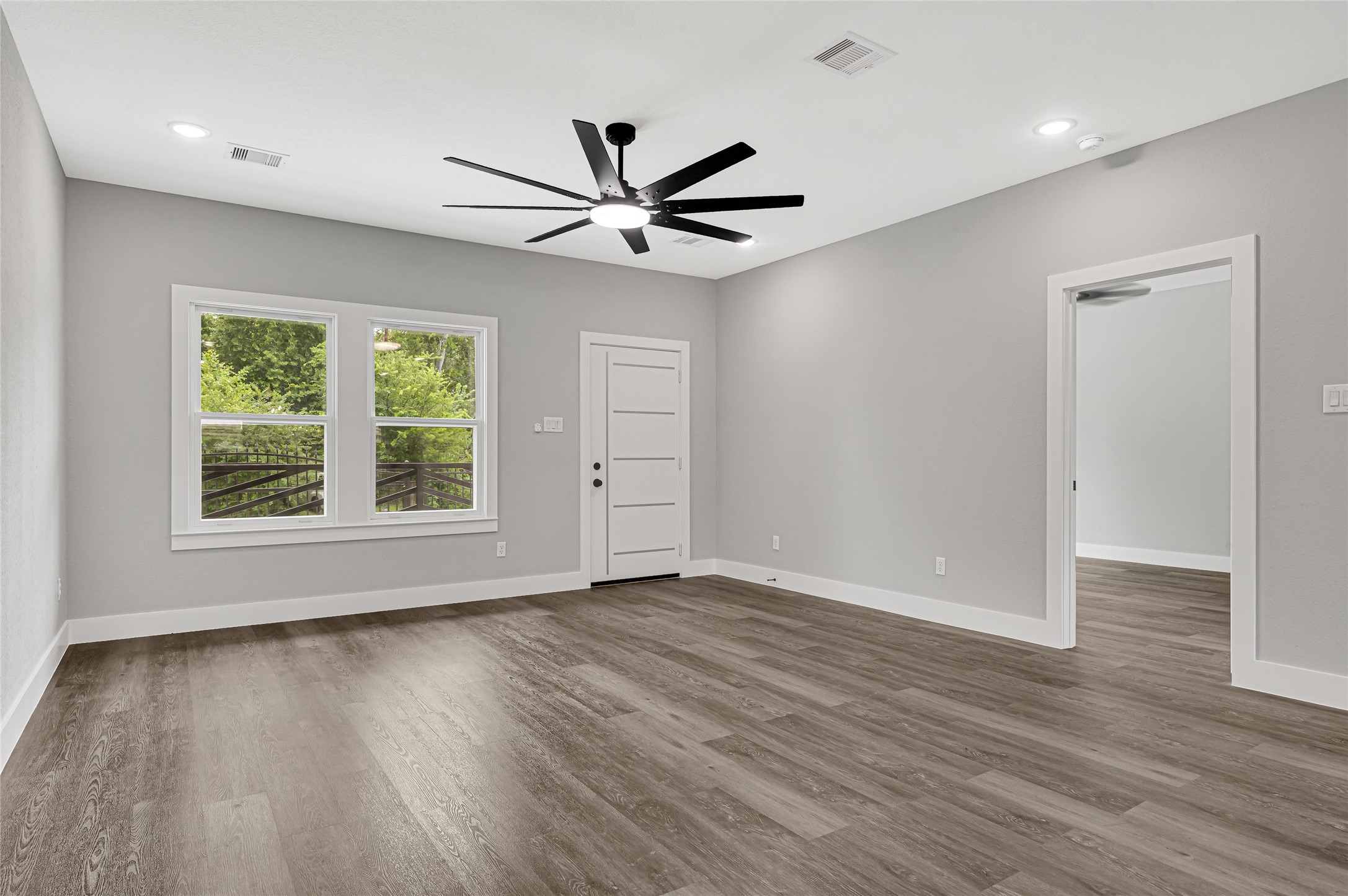 5930 Boness Road, Unit A & B Houston, TX 77396 - Photo 9 of 43 Additional view of the living room featuring high ceilings and remote-controlled ceiling fans in both the living room and all bedrooms.