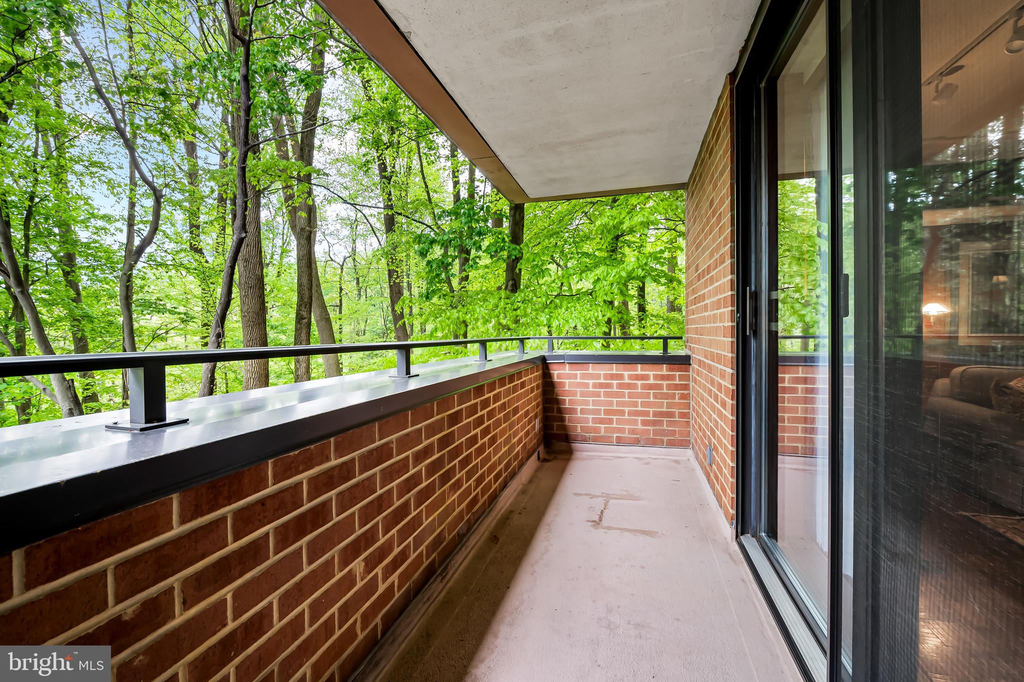 111 Hamlet Hill Road, Unit 205 Baltimore, MD 21210 - Photo 45 of 65 a view of balcony with wooden floor and outdoor space