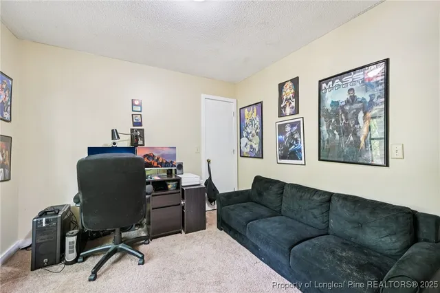 a bedroom with furniture and a book shelf