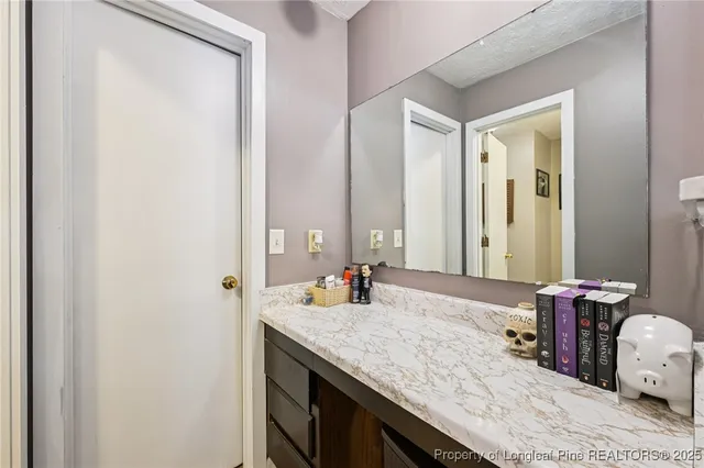 a view of a house with a yard and furniture