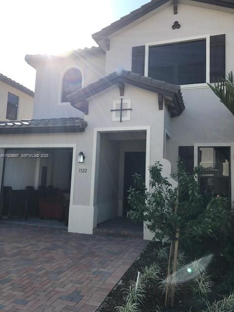 3322 West 97th Street, Unit 3322 Hialeah, FL 33018 - Photo 1 of 6 a front view of a house with a yard