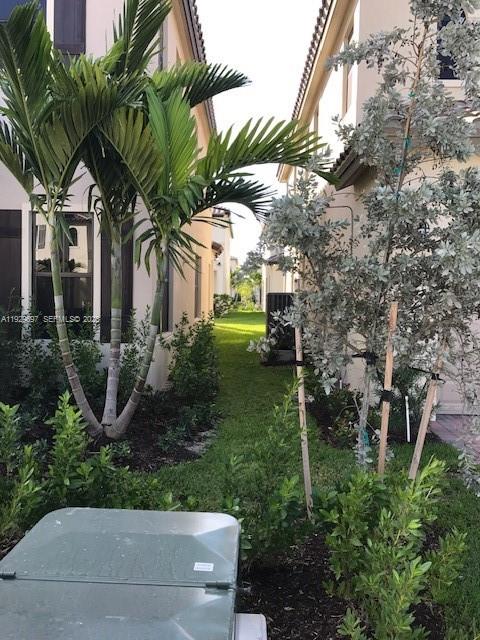 3322 West 97th Street, Unit 3322 Hialeah, FL 33018 - Photo 3 of 6 a view of a yard in front of house