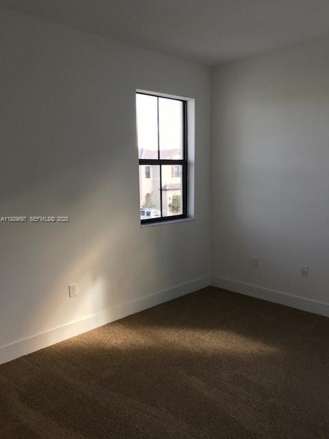 3322 West 97th Street, Unit 3322 Hialeah, FL 33018 - Photo 6 of 6 an empty room with a window