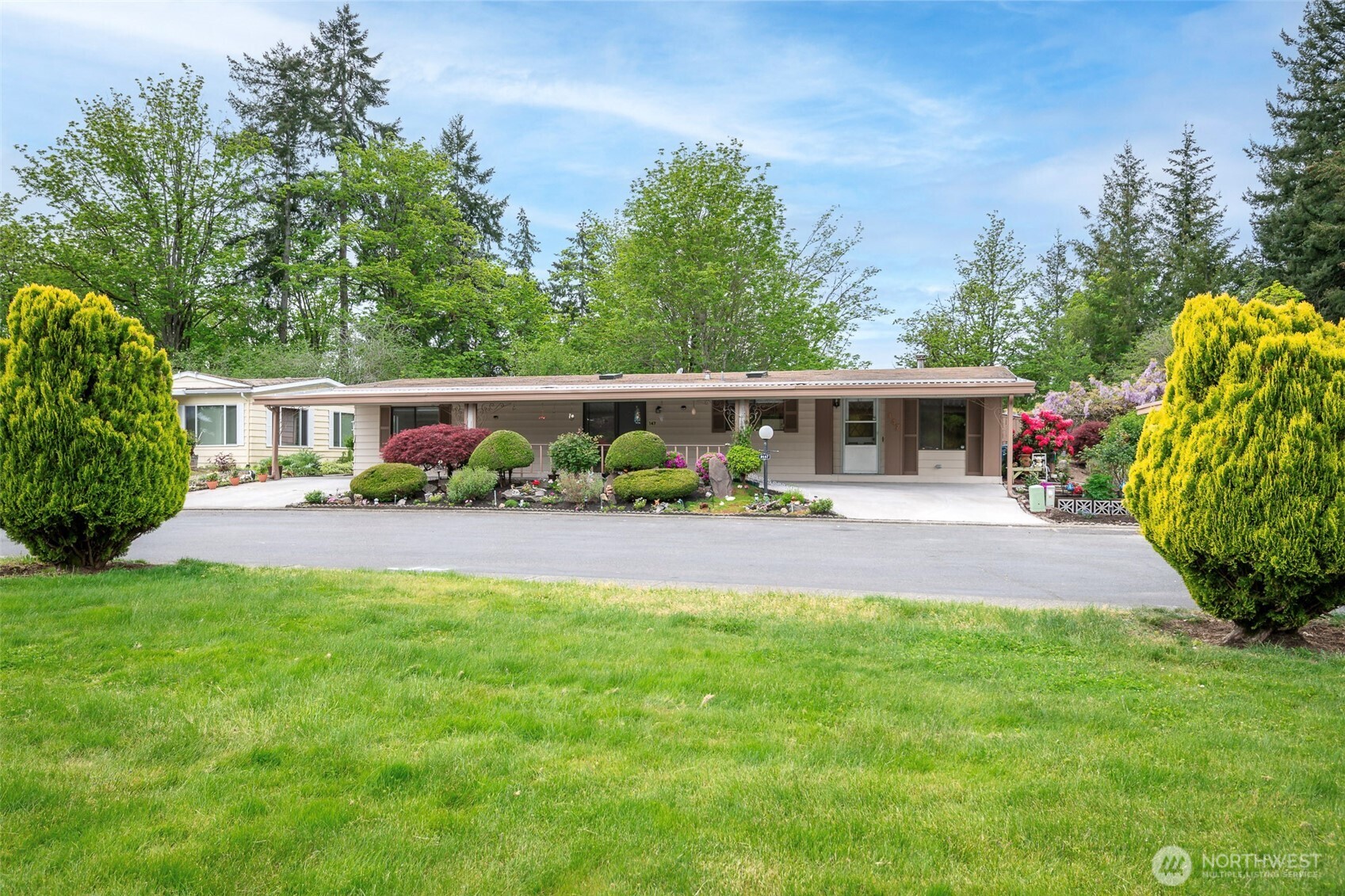 a view of house with swimming pool yard and outdoor seating