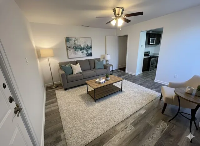 a living room with furniture and a fireplace