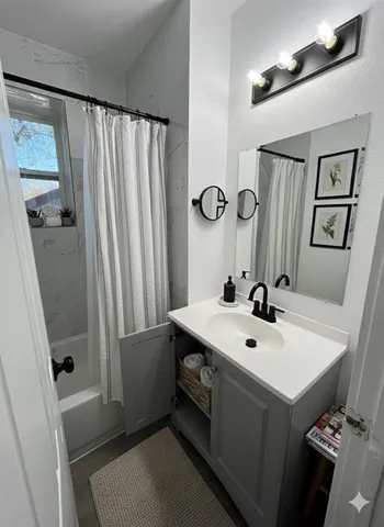 a bathroom with a sink a mirror and a toilet