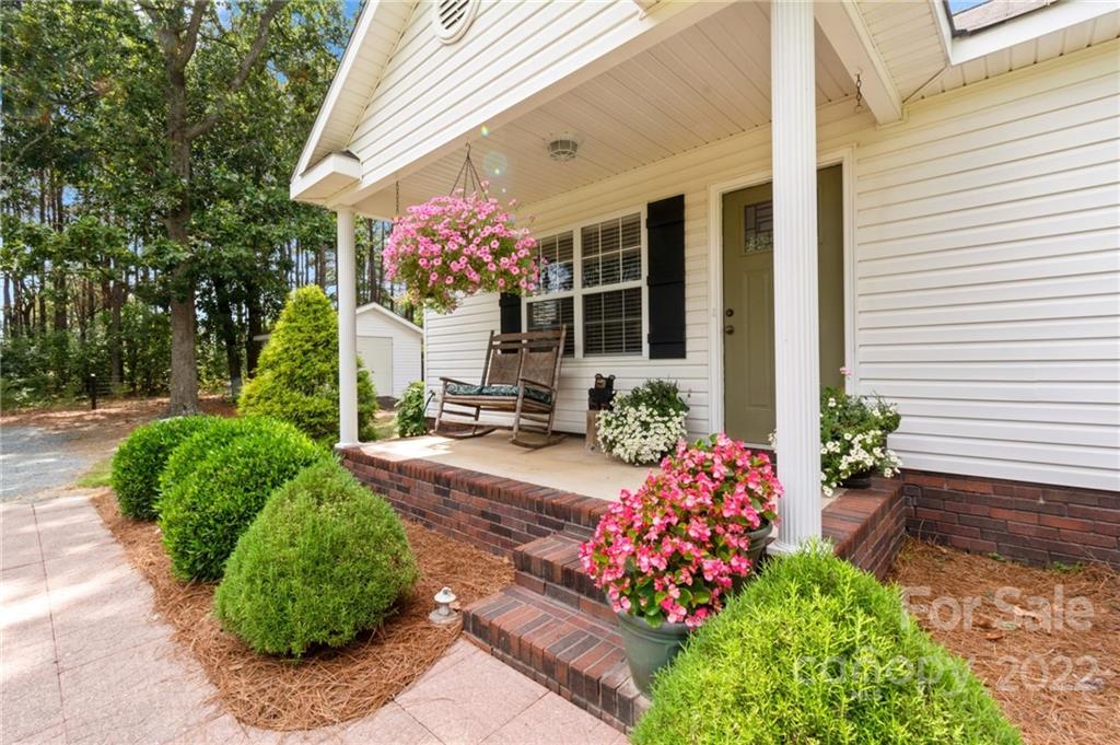 1801 Mullis Road Monroe, NC 28112 - Photo 4 of 27 a front view of a house with a yard and fountain