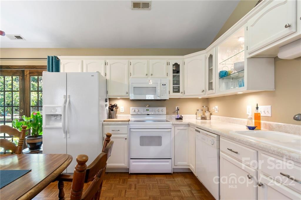 1801 Mullis Road Monroe, NC 28112 - Photo 6 of 27 a kitchen with stainless steel appliances a refrigerator sink and cabinets