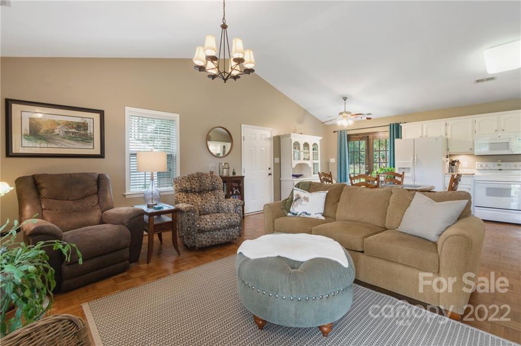 1801 Mullis Road Monroe, NC 28112 - Photo 10 of 27 a living room with furniture and a chandelier