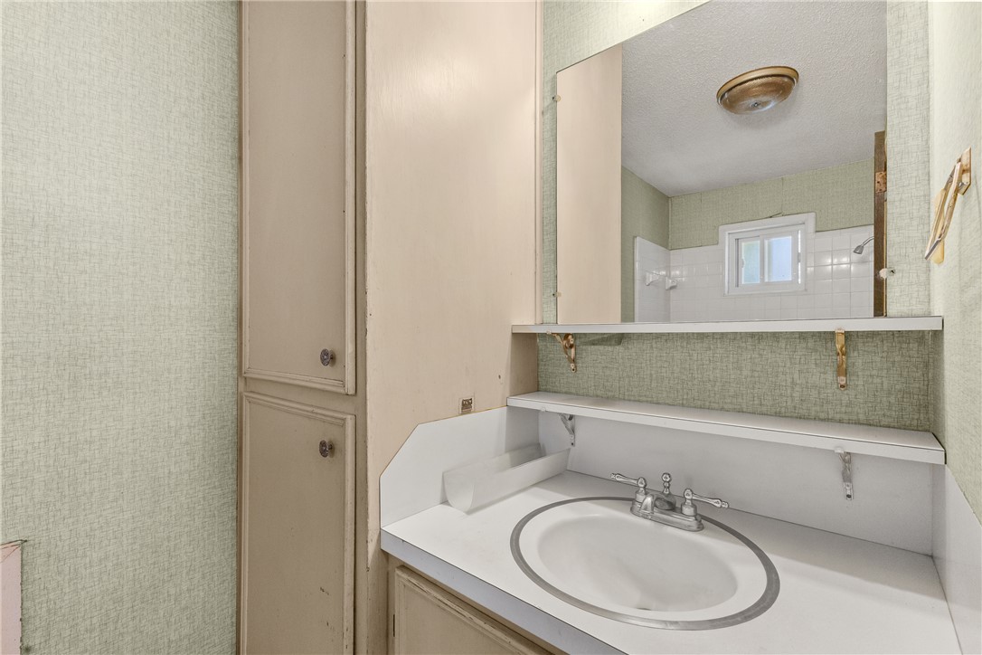 3003 Kim Street Bryan, TX 77803 - Photo 12 of 21 a bathroom with a sink and a mirror