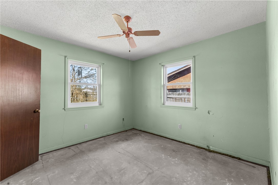 3003 Kim Street Bryan, TX 77803 - Photo 14 of 21 a view of an empty room with a ceiling fan