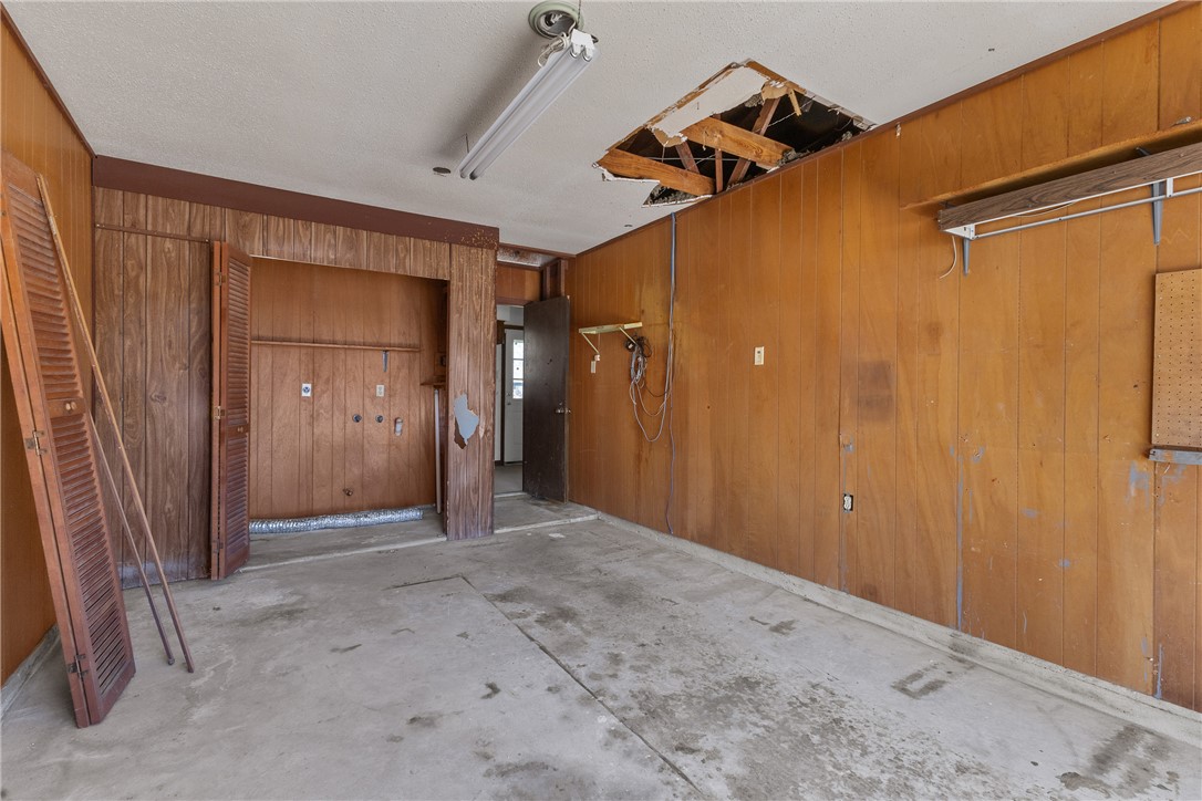 3003 Kim Street Bryan, TX 77803 - Photo 7 of 21 an empty room with wooden floor and windows