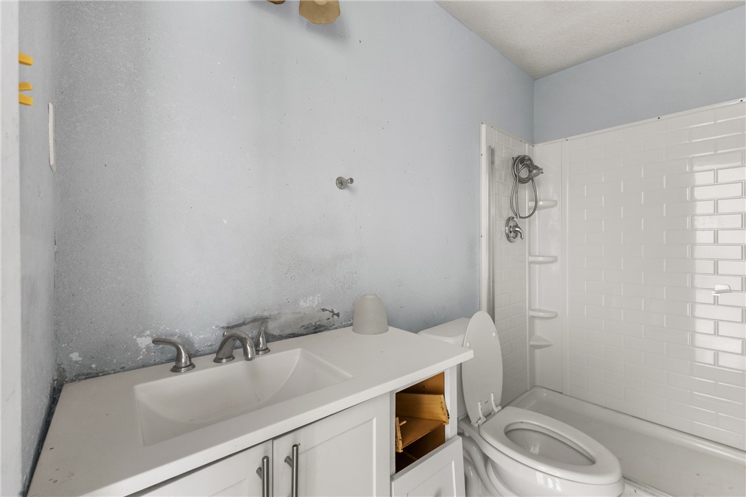 3003 Kim Street Bryan, TX 77803 - Photo 8 of 21 a bathroom with a sink toilet and shower