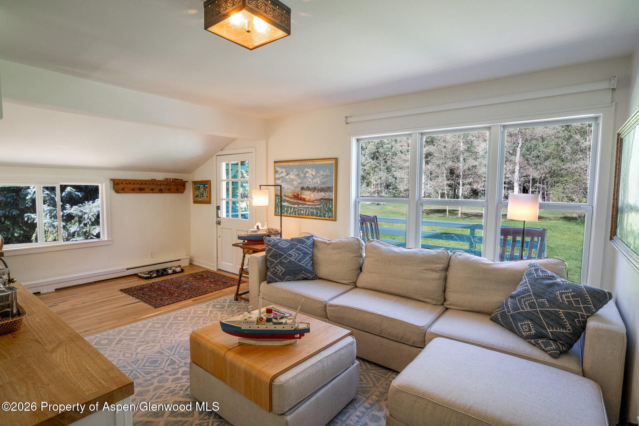 285 Conundrum Creek Road Aspen, CO 81611 - Photo 13 of 35 a living room with furniture and a large window