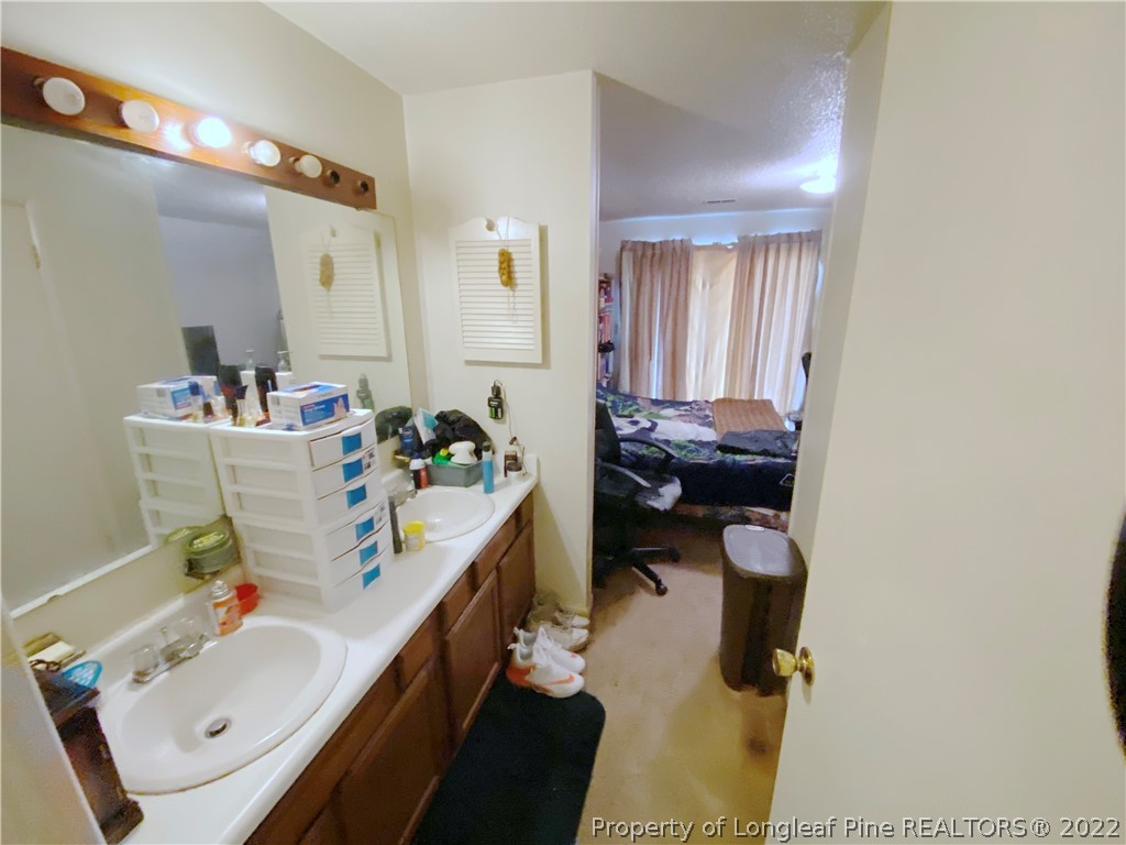 1815 Rivergate Road Fayetteville, NC 28304 - Photo 10 of 14 a room with a baby bed furniture and a window