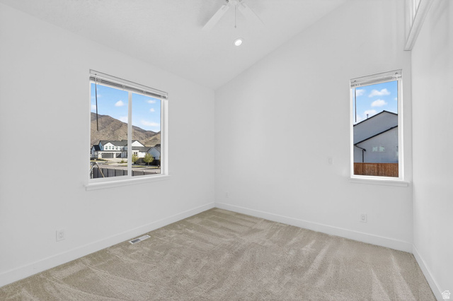 572 West 500th Street North Mapleton, UT 84664 - Photo 18 of 46 Spare room featuring light carpet, lofted ceiling, ceiling fan, and recessed lighting