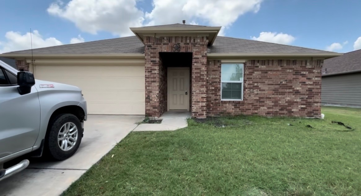 137 Rafe Court Kyle, TX 78640 - Photo 2 of 8 A classic brick exterior welcomes residents to this charming single-story home.