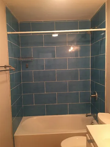 a view of a bathroom with a bathtub