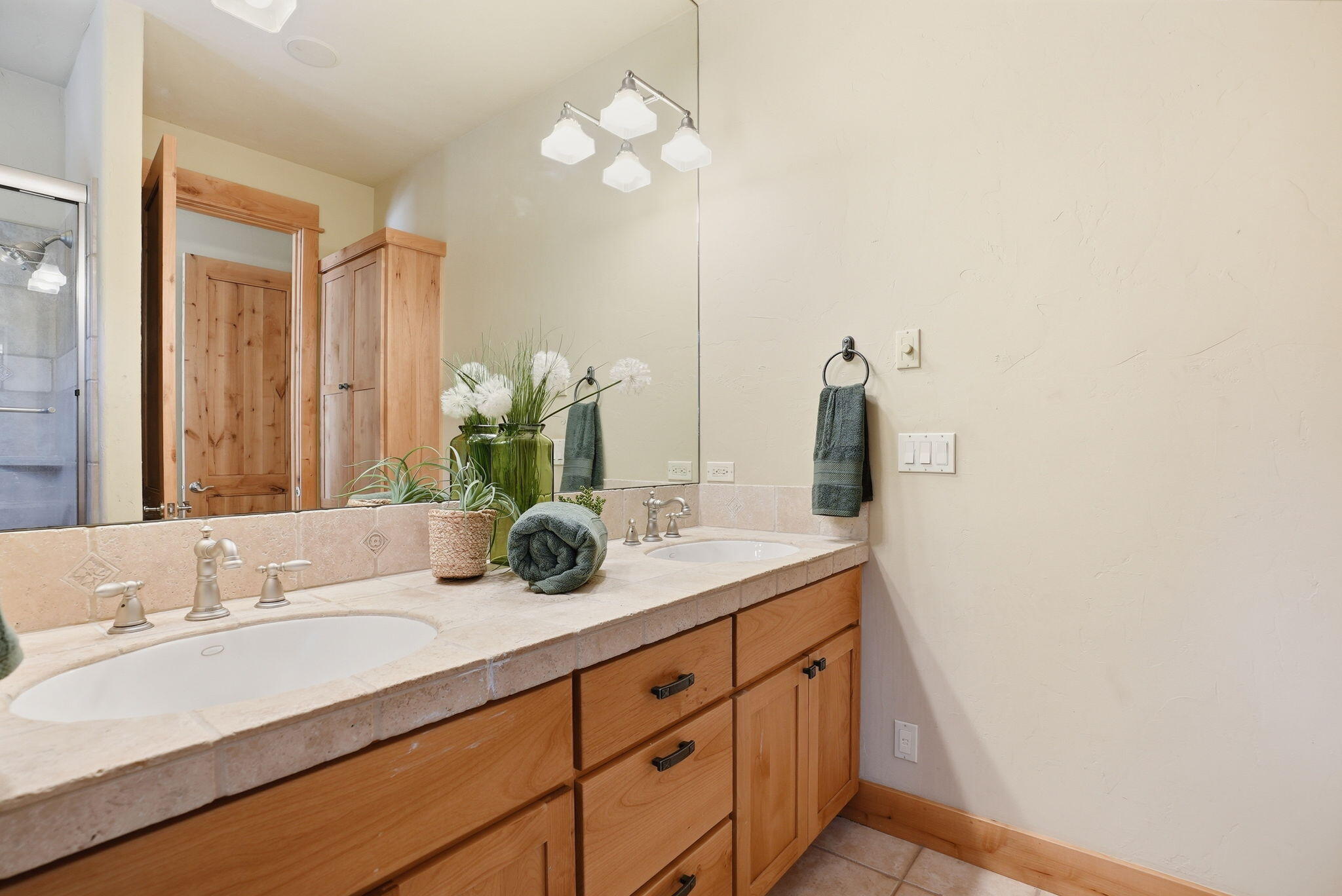 631 Sundance Ridge Court Redmond, OR 97756 - Photo 40 of 61 a bathroom with a sink and a mirror