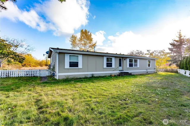a backyard of a house with lots of green space