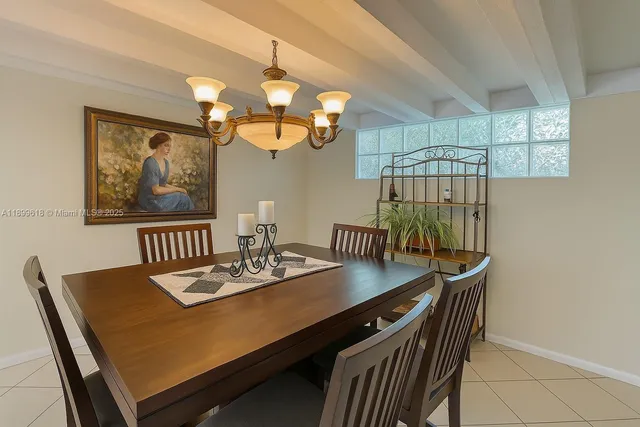 a kitchen with a sink a stove and a dining table