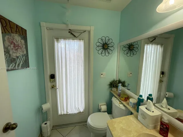 a bathroom with a sink double vanity granite and a mirror
