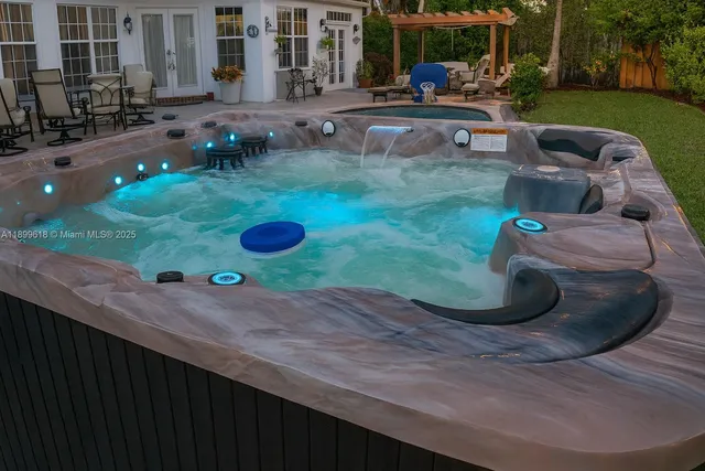 a view of a patio with couches chairs and potted plants