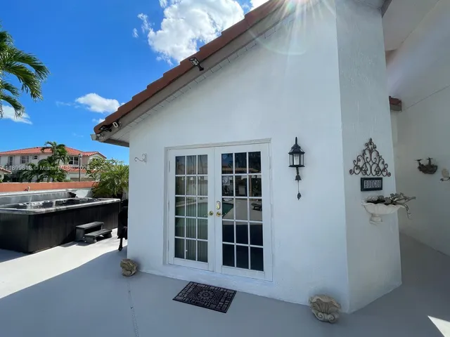 a bedroom with a bed and flat screen tv