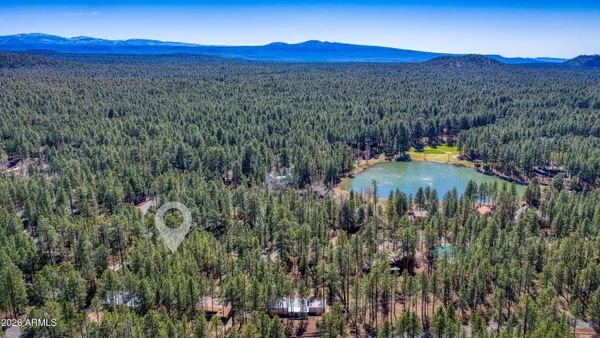 a view of a house with a tree