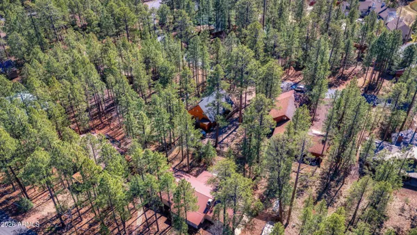 an aerial view of a house with a garden