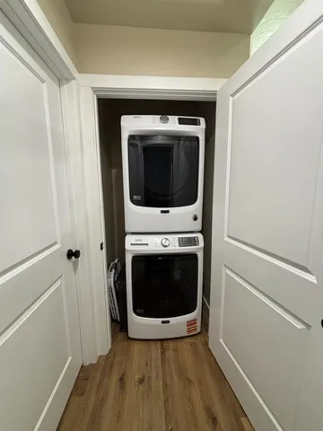 a view of a hallway with washer and dryer