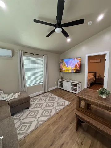 a bedroom with a bed and glass windows