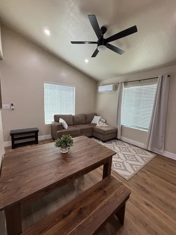 a view of kitchen with sink dining table and chairs