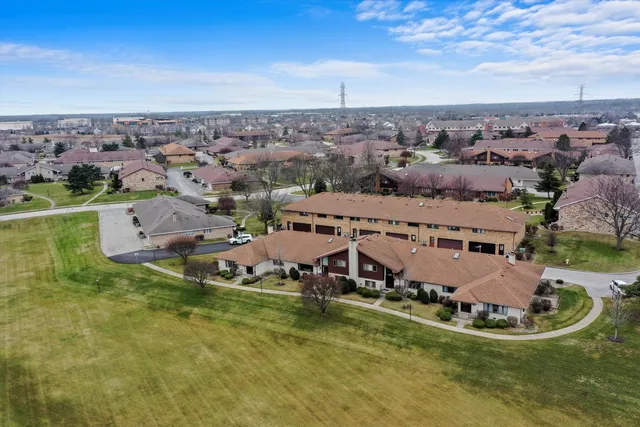 an aerial view of a house with a lake view