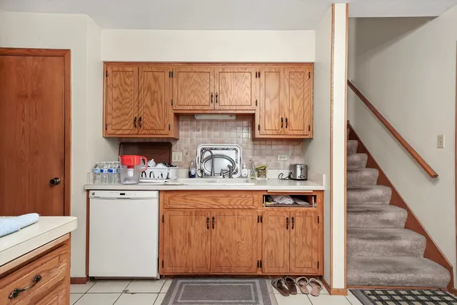 a kitchen with stainless steel appliances granite countertop a sink and cabinets