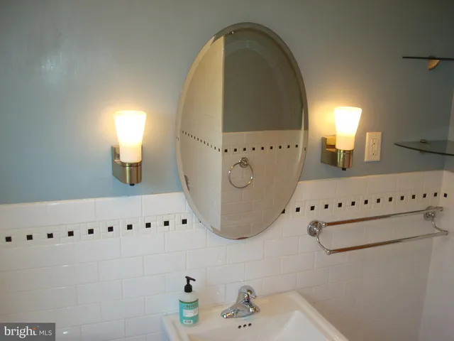 a bathroom with a sink and a window