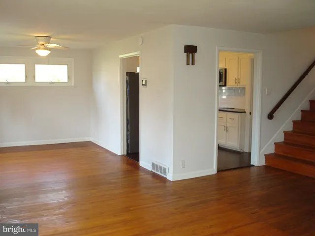 a kitchen with a refrigerator and a window
