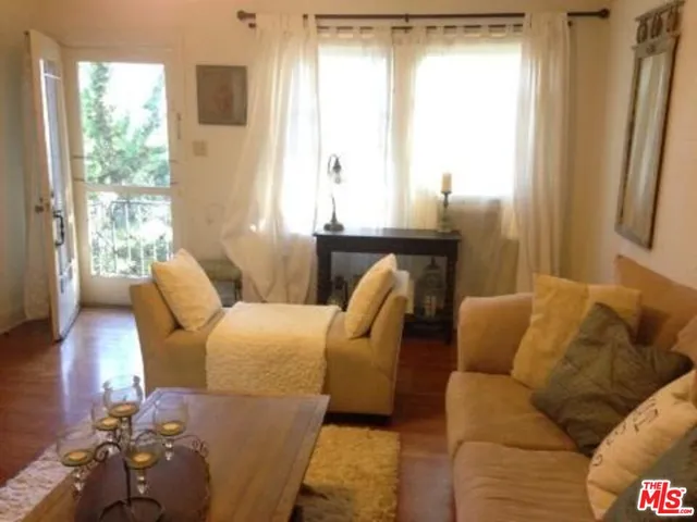 a utility room with lots of different colored cloths