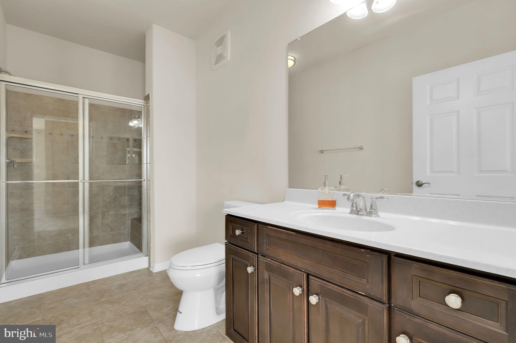 3750 Clara Downey Avenue, Unit 34 Silver Spring, MD 20906 - Photo 18 of 25 a bathroom with a sink a toilet and shower
