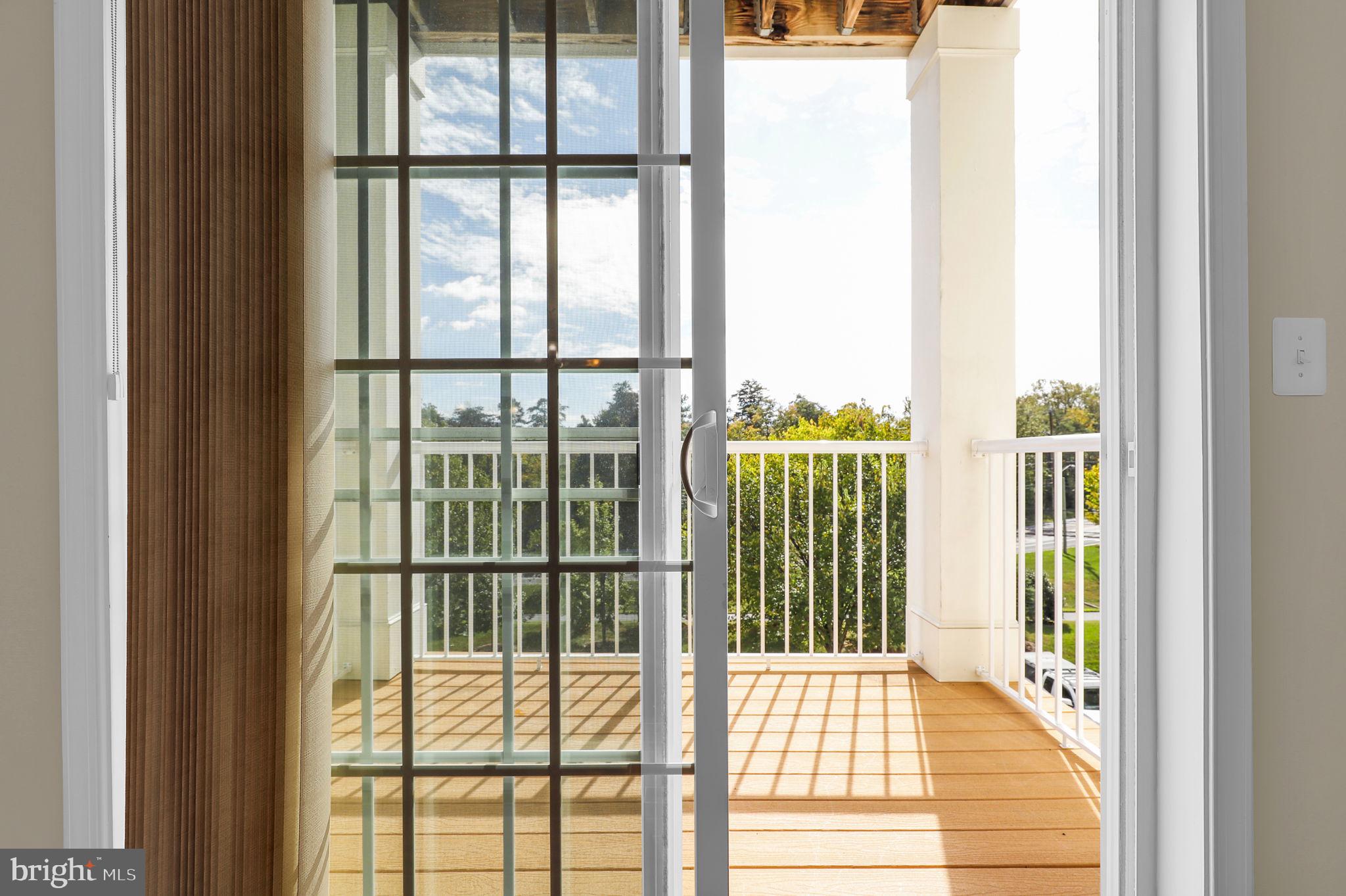 3750 Clara Downey Avenue, Unit 34 Silver Spring, MD 20906 - Photo 22 of 25 a view of a balcony from a door