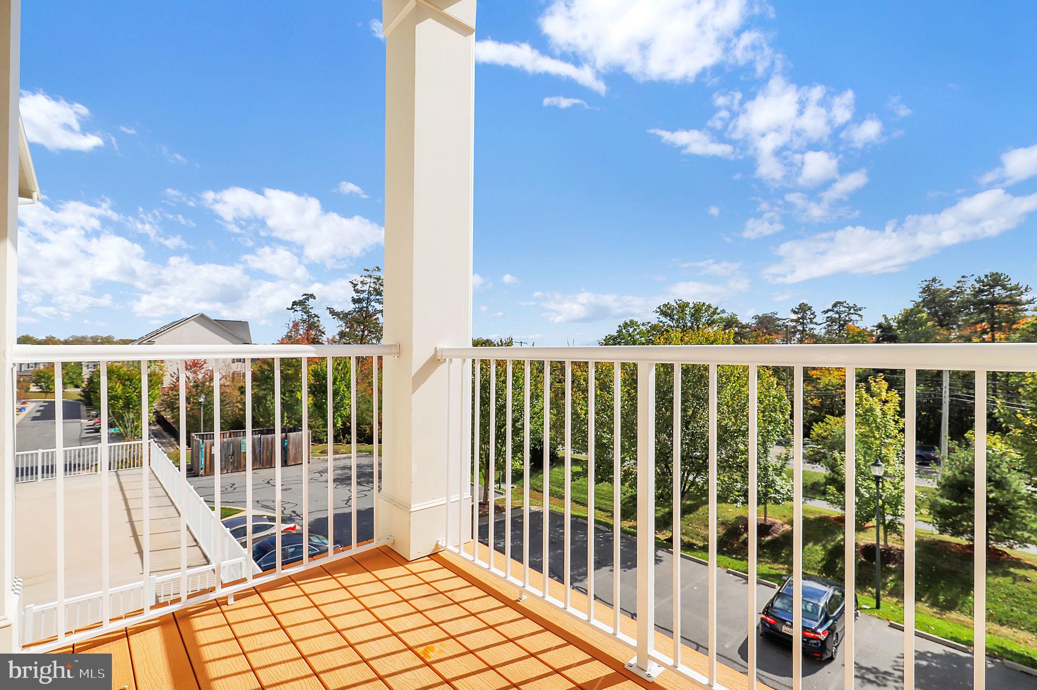 3750 Clara Downey Avenue, Unit 34 Silver Spring, MD 20906 - Photo 23 of 25 a view of a balcony with a potted plant