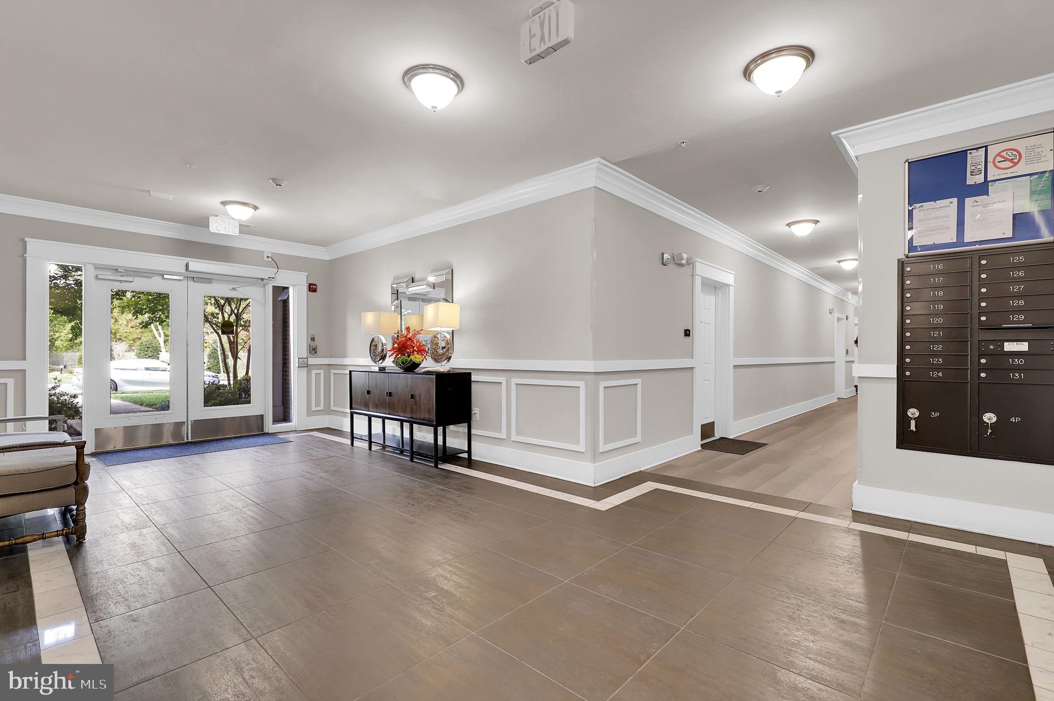 3750 Clara Downey Avenue, Unit 34 Silver Spring, MD 20906 - Photo 24 of 25 a living room with furniture and a table
