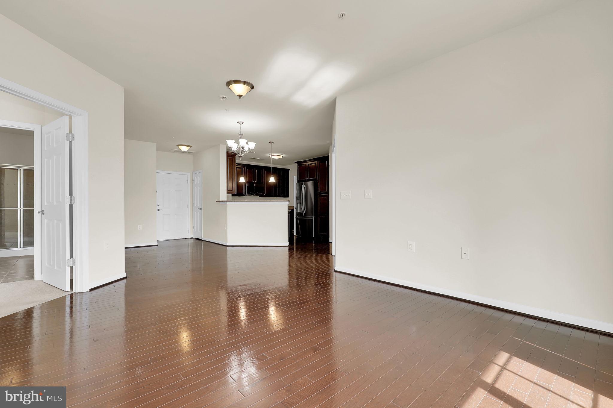 3750 Clara Downey Avenue, Unit 34 Silver Spring, MD 20906 - Photo 6 of 25 a view of a kitchen with a dishwasher and wooden floor