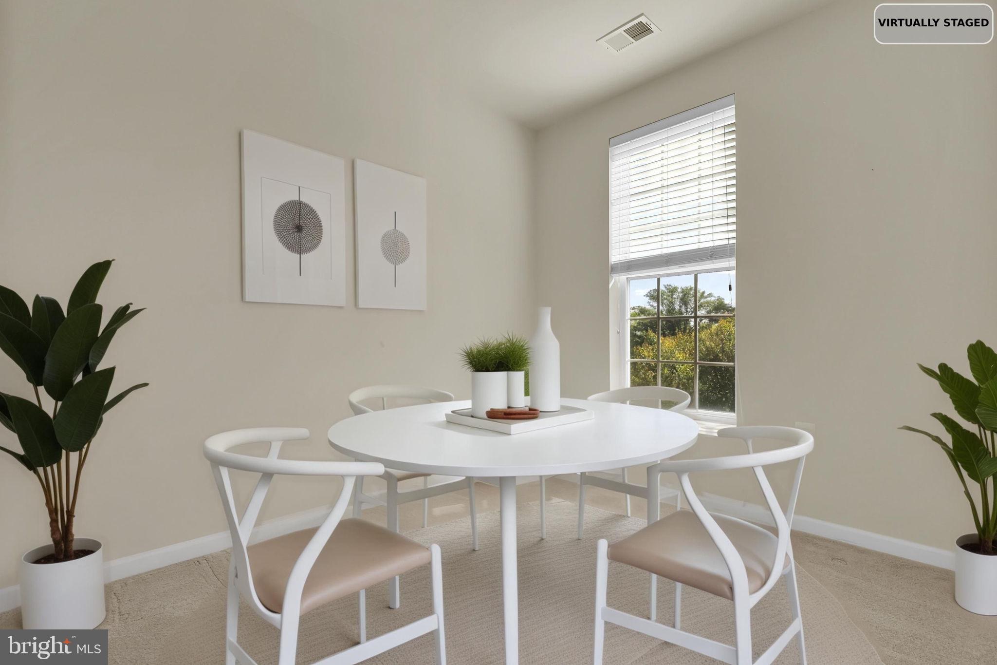 3750 Clara Downey Avenue, Unit 34 Silver Spring, MD 20906 - Photo 7 of 25 a dining room with furniture and potted plants