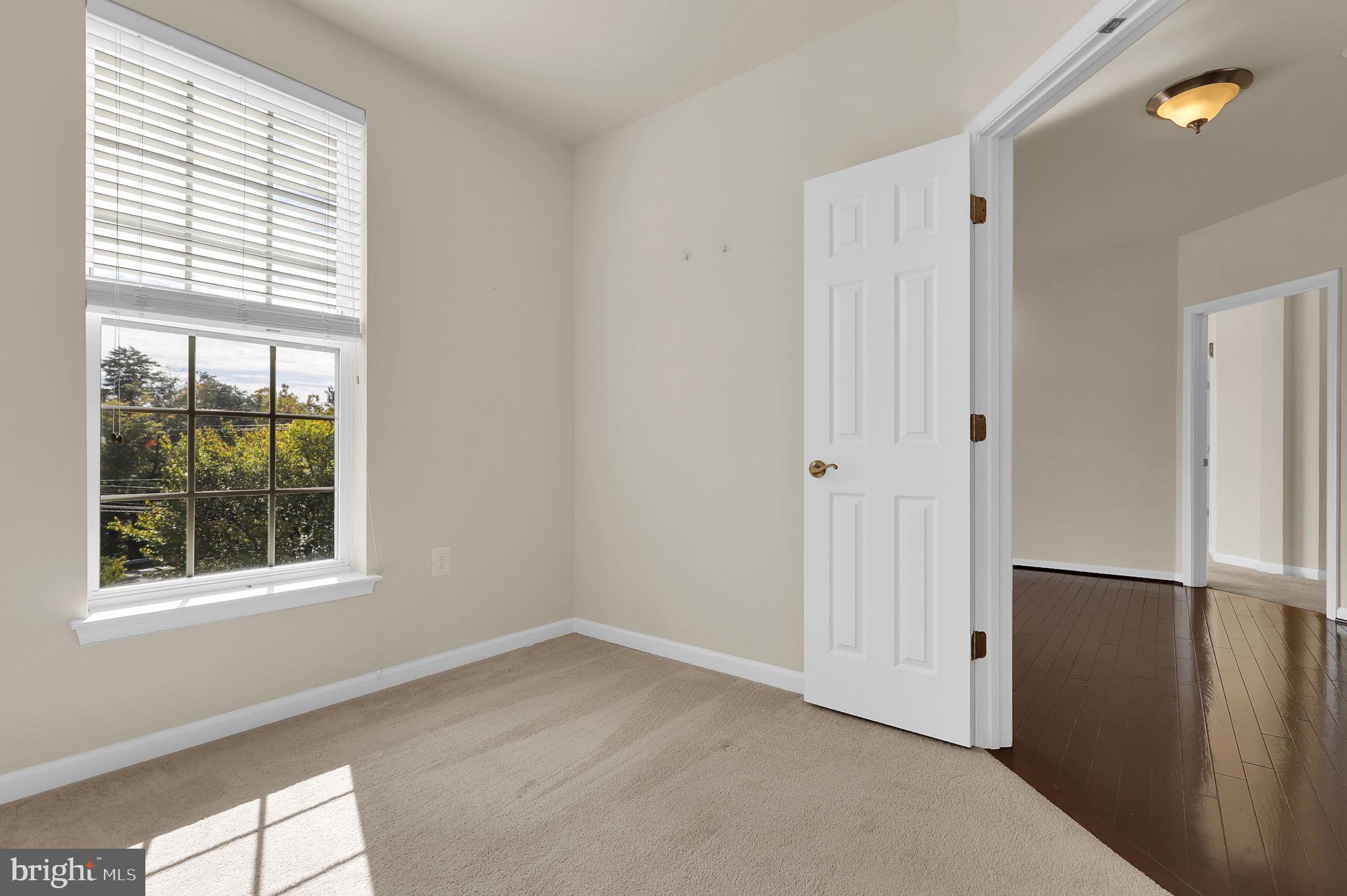 3750 Clara Downey Avenue, Unit 34 Silver Spring, MD 20906 - Photo 8 of 25 an empty room with windows