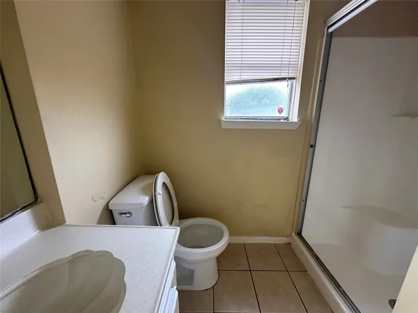 a bathroom with a toilet and a sink