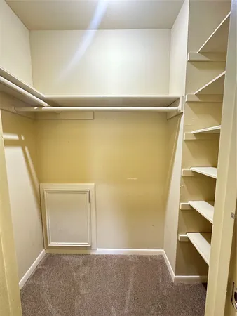 a view of an empty walk in closet