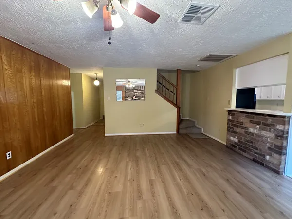 a view of a livingroom with wooden floor